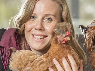 Girl with pet chickens