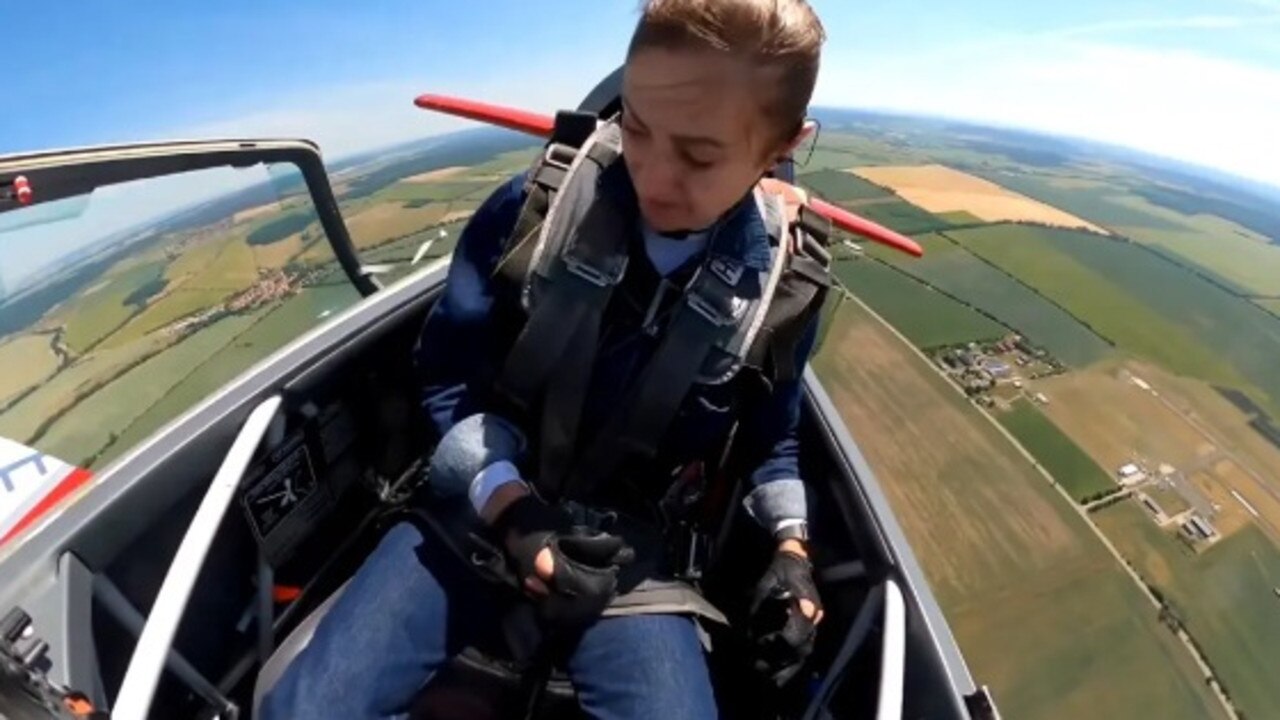 A visibly distraught Melkumjan could be seen struggling to keep her eyes open as the wind beat her face in the moments after the canopy burst. Picture: X/NarineMelkumjan