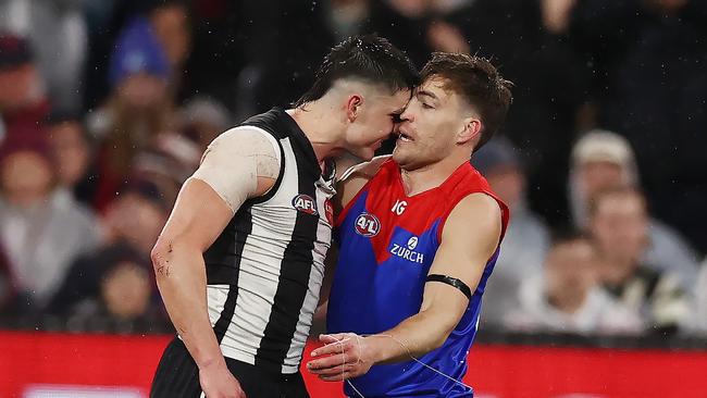 Jack Viney and Brayden Maynard face-off after the Collingwood star’s heavy hit on Angus Brayshaw. Photo by Michael Klein.