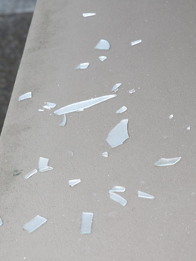 Remnants of shattered glass on the window sills of the Newport apartment. Picture: Martin Lange.