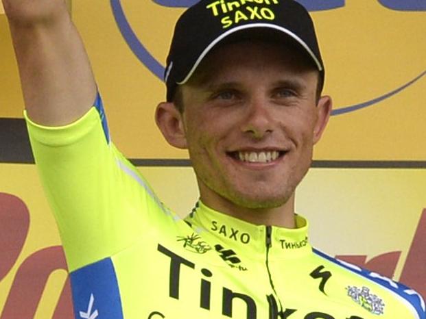 Stage winner Poland's Rafal Majka celebrates on the podium after winning the 177 km fourteenth stage of the 101st edition of the Tour de France cycling race on July 19, 2014 between Grenoble and Risoul, eastern France. AFP PHOTO / ERIC FEFERBERG