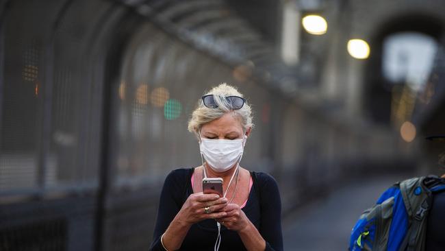 A woman in Sydney trying to protect herself from the “poor” air quality.