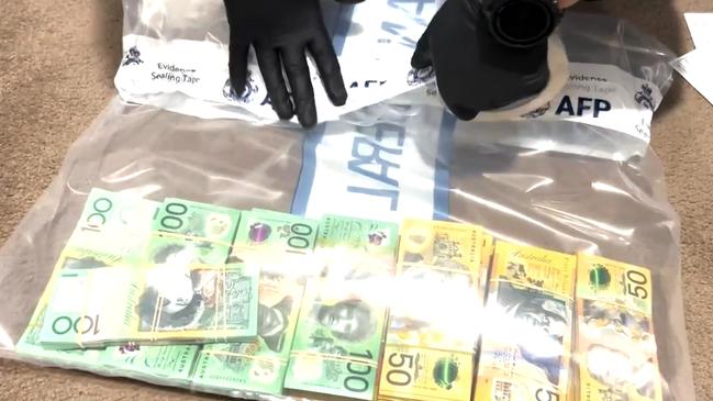 Police allegedly uncovered more than $210,000 at a home in Box Hill. Picture: NCA NewsWire / AFP Handout