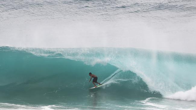 Surfers at Snapper Rocks and Kirra riding the Large swell produced by Cyclone OMA. Photograph : Jason O'Brien
