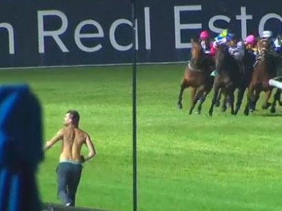 Security tries to tackle a track invader at Cranbourne