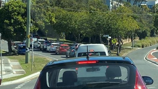 The queue on moggill road Taronga outside the QML testing centre