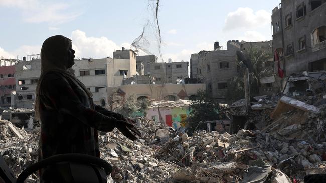 A Palestinian woman gestures as she explains how her home was destroyed duing the Israeli bombardment, in Bureij in the central of Gaza Strip, on November 14, 2023. Picture: AFP)