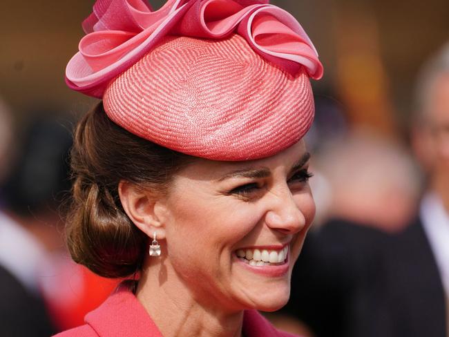 Kate Middleton was all smiles at a garden party at Buckingham Palace. Picture: AFP