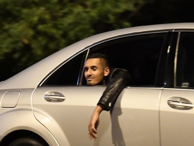 Nick Kyrgios was seen hanging out of the car window as he made his way home with the girls. Picture: BACKGRID