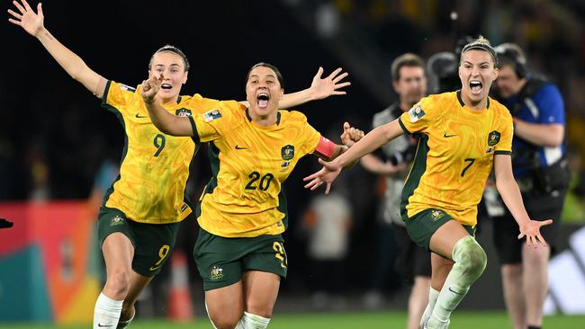 Caitlin Foord, Sam Kerr and Steph Catley of Australia celebrate the team’s victory against France. Picture: Quinn Rooney