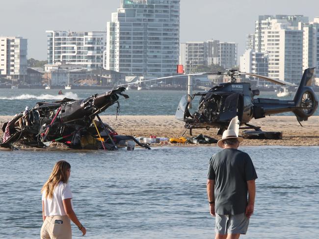 The devasting scene of a Helicopter crash between two Seaworld Helicopters just outside the tourist park on a sandbank in the Southport Broadwater.   .Picture Glenn Hampson