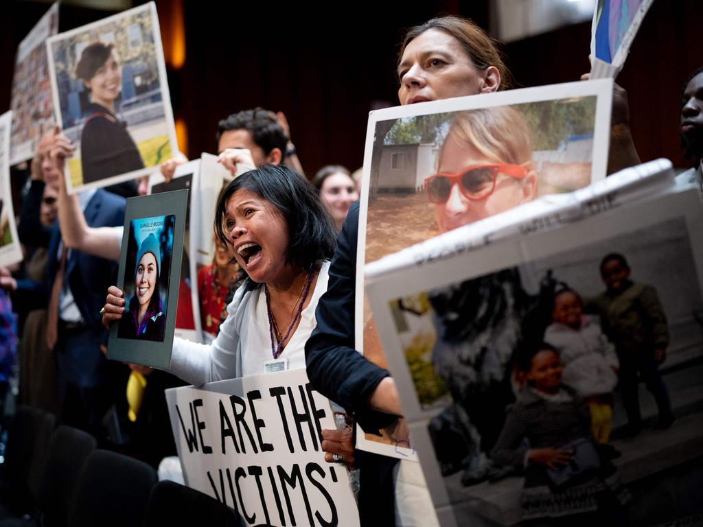 Clariss Moore of Toronto, Canada, holds a photo of her daughter Danielle Moore and stands with other family members of those killed in the Ethiopian Airlines flight and Lion Air Flight at the senate inquiry on June 18. Picture: Andrew Harnik / Getty Images