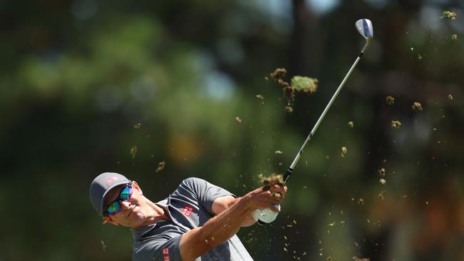 Adam Scott plays a shot. (Photo by Mark Metcalfe/Getty Images)