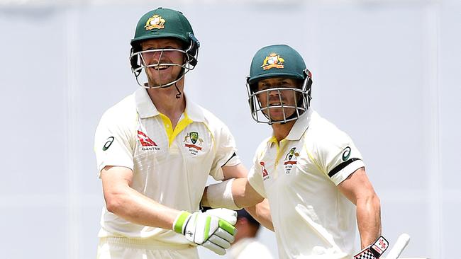 Australian batsmen David Warner, right, and Cameron Bancroft celebrate. Picture: AAP.