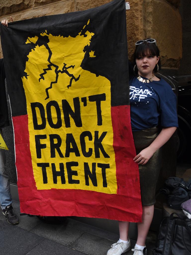 Protesters and indigenous owners from the Northern Territory hold a small rally outside the Annual General Meeting for Origin Energy in Sydney, Wednesday, October, 18, 2017. The protest was calling on Origin Energy to stop their fracking gasfield exploration activities in the Northern Territory. (AAP Image/Dean Lewins) NO ARCHIVING