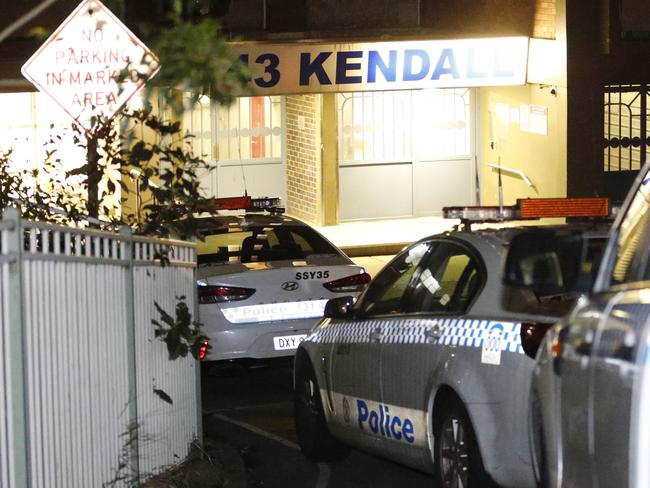 Police cars in the driveway of a housing commission building after a fatal stabbing on Morehead Road, Redfern. Picture : Steve Tyson