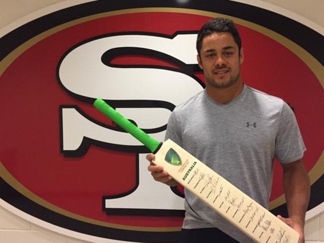 Hayne was like a kid with a new toy when presented the signed bat from Cricket Australia.