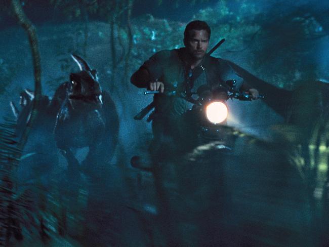 Hot pursuit ... Chris Pratt as Owen leads the raptors on a mission in a scene from the film Jurassic World. Picture: ILM/Universal Pictures/Amblin Entertainment via AP