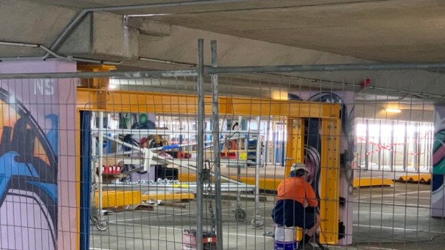 Workers on site with repair work undertaken at the Bruce Bishop car park in Surfers Paradise.