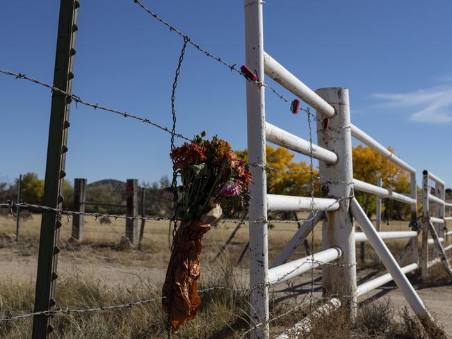 A bouquet of flowers hangs on a barb wire near Bonanza Creek Ranch where actor Alec Baldwin accidentally killed cinematographer Halyna Hutchins on a movie set in New Mexico. Picture: Mostafa Bassim Adly/Anadolu Agency.