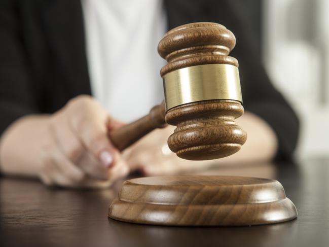 Caucasian woman holding gavel