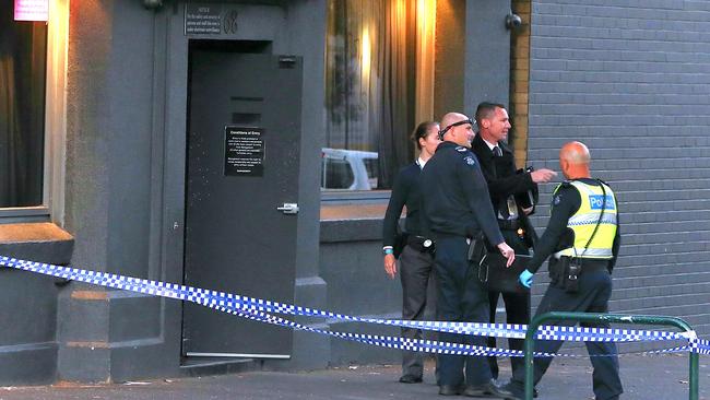 Police investigate the scene outside Kittens in South Melbourne. Picture: Ian Currie