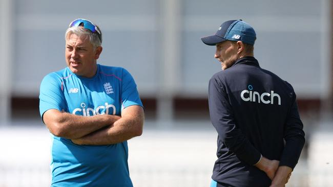 Chris Silverwood and Joe Root chat during a training session. Picture: Adrian Dennis