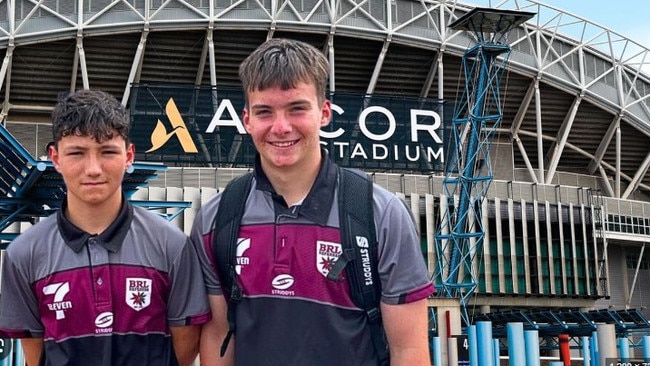 Logan teen Harrison Western, right, went to Sydney last year to give the grand final referee a medal after the big match. Picture: Contributed