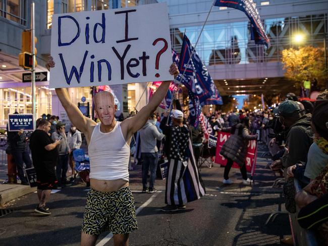 ‘Did I win yet?’ Supporters of US President Donald Trump held signs and chanted slogans during a protest outside the Philadelphia Convention Centre. Picture: AFP