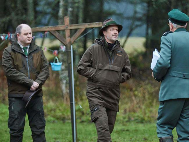 Crown Prince Frederik of Denmark speaks with Master Court Hunter Jens Bjerregaard Christensen next to Danish politician Finn Poulsen. Picture: AFP