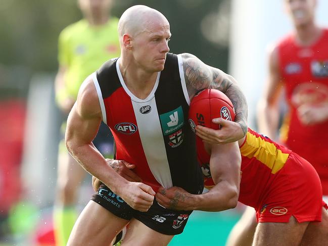 GOLD COAST, AUSTRALIA - MAY 08: Zak Jones of the Saints is tackled during the round eight AFL match between the Gold Coast Suns and the St Kilda Saints at Metricon Stadium on May 08, 2021 in Gold Coast, Australia. (Photo by Chris Hyde/Getty Images)