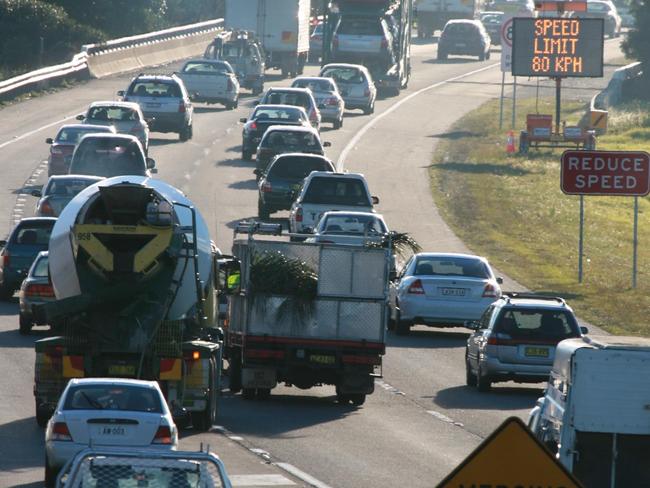 Morning traffic on the M5 near the Brooks Rd overpass, Campbelltown, where motorists are stung up to 40 per cent more for CTP than in nearby Camden.