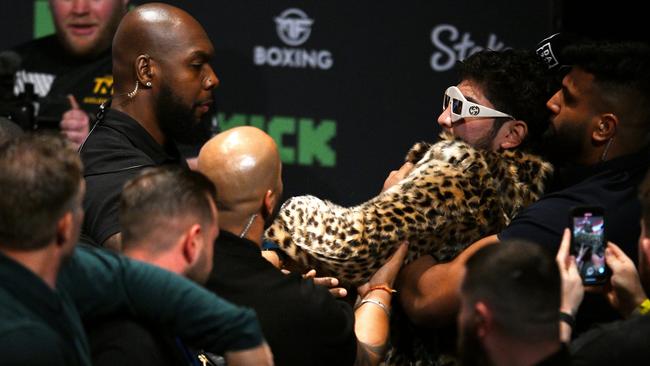 Dillon Danis is held back after clashing with Logan Paul. (Photo by Ben Roberts Photo/Getty Images)