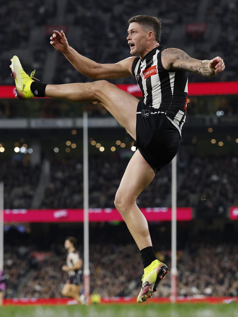 Jack Crisp of the Magpies kicks at goal against Hawthorn. Picture: Michael Klein.