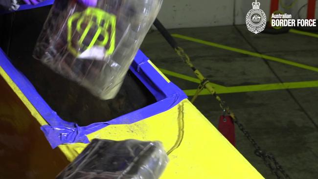 Bags are removed from the excavator in the largest drug interception operation co-ordinated by ACT Policing. Picture: Australian Border Force