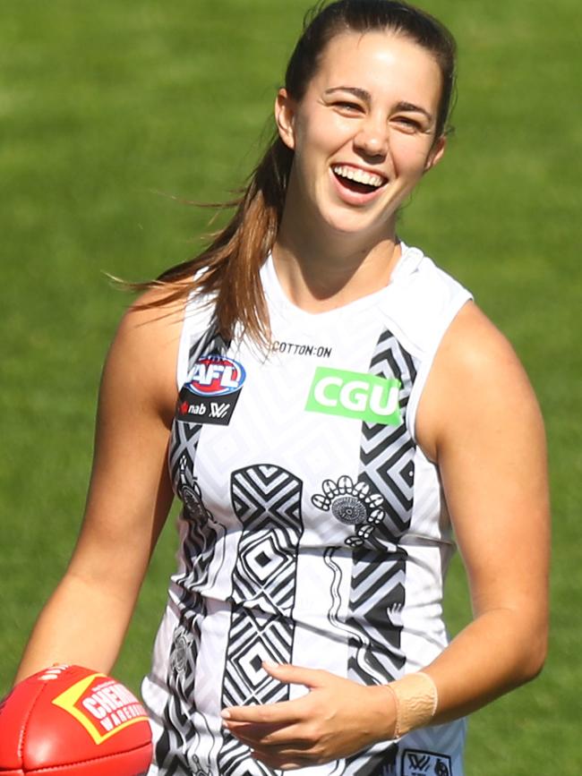 Chloe Molloy is all smiles in the Pies Indigenous jumper, which they will wear at all AFLW away games in 2021. Picture: Getty Images