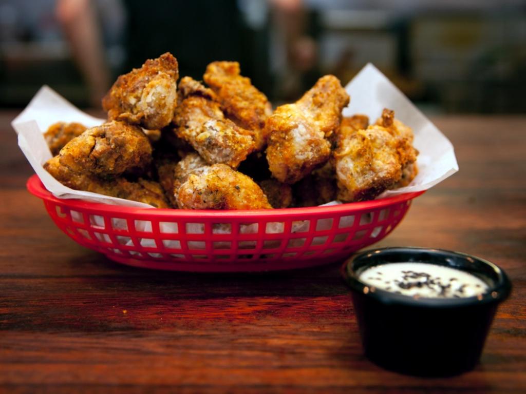 <span class="h2">Tippler's Tap</span>                  <b>22 Masters St, Newstead. Price: $10 for 1kg.</b> A $10 bill will score you an entire kilogram of wings at Tipplers, making it one of the best value meals in town. The small-sized wings are served dry, rather than sauced, with a crispy, herbed coating and side of blue cheese sauce for dipping. They are always cooked well, and the price alone has catapulted them to cult-status in Brisbane. <b><a href="http://www.tipplerstap.com.au/" title="www.tipplerstap.com.au">More details</a></b>