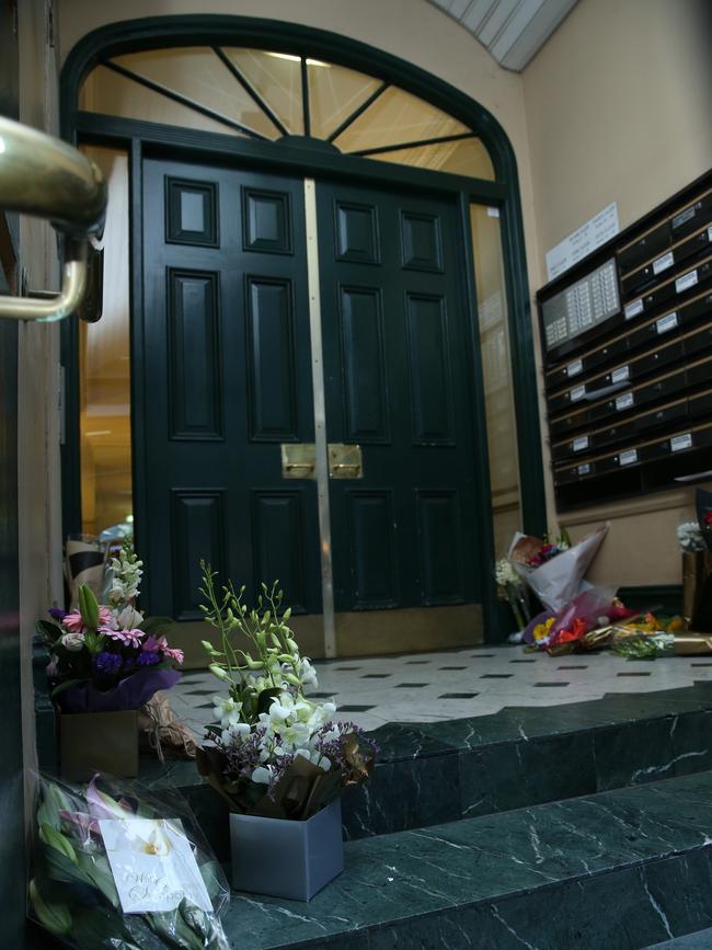 Fowers at the entrance to Clarence House in Sydney's CBD, the apartment block where Michaela Dunn, 24 was killed in a stabbing attack. Picture: Britta Campion / The Australian