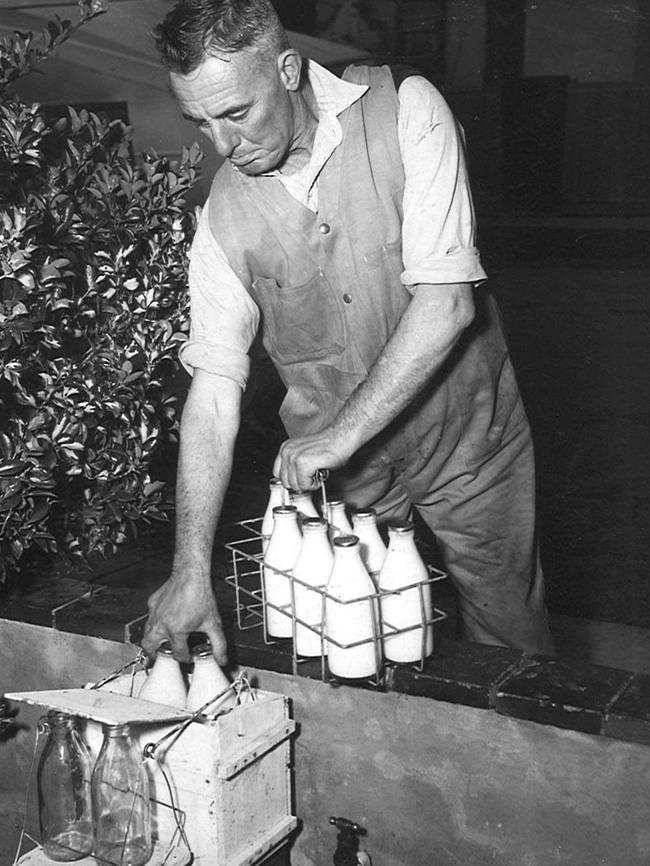 A milkman makes a home delivery in 1952.