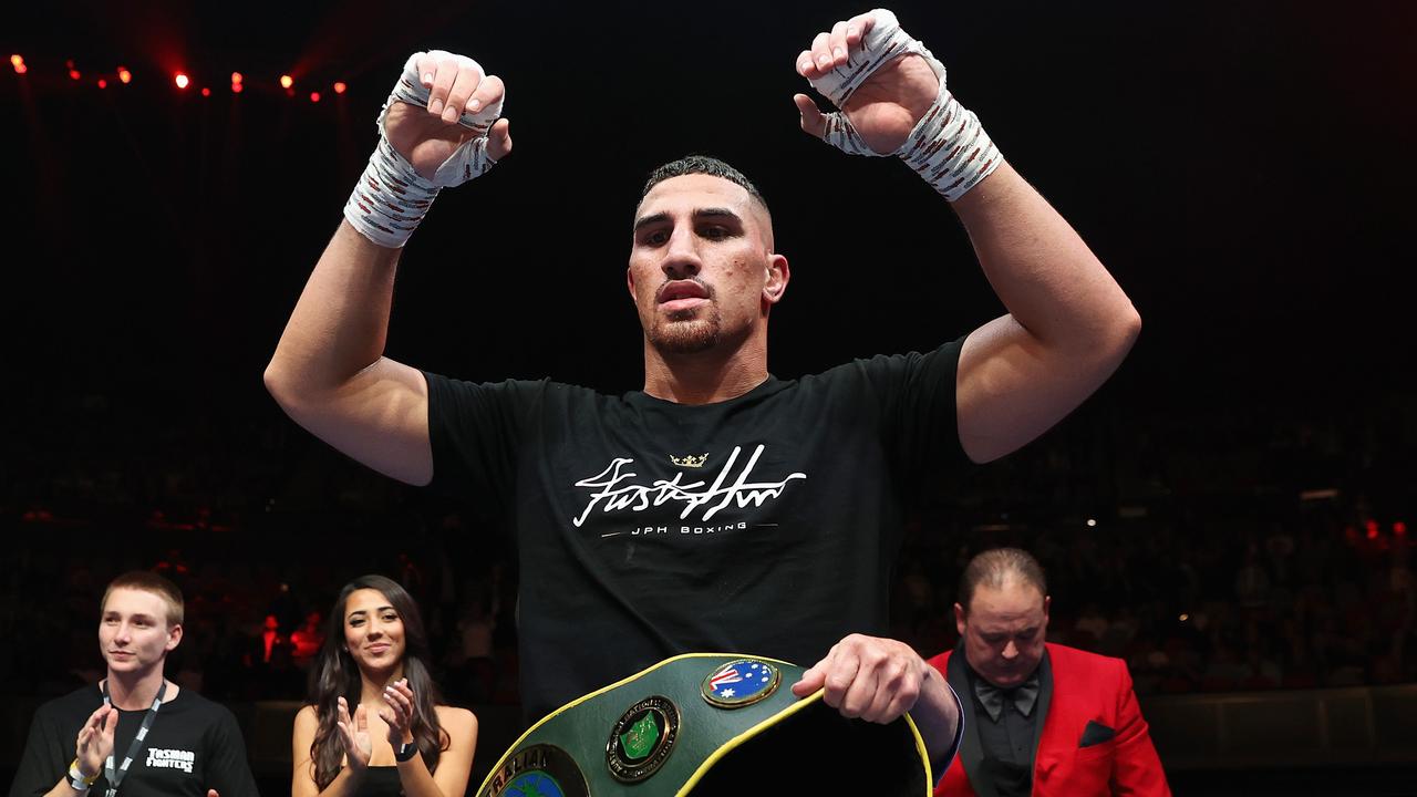 SYDNEY, AUSTRALIA - JUNE 16: Justis Huni celebrates winning his Australian heavyweight title fight against Paul Gallen at ICC Sydney on June 16, 2021 in Sydney, Australia. (Photo by Cameron Spencer/Getty Images)