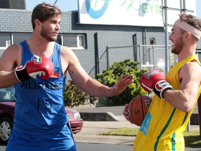 Tom Hawkins and Jackson Thurlow reprise the basketball rivalry between Australia and the Philippines. Picture: Alison Wynd