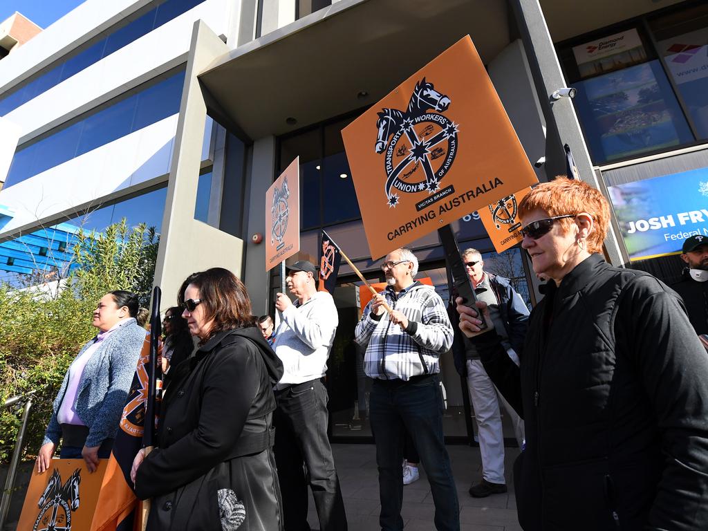 Protesters are seen outside the office of Australian Federal Treasurer Josh Frydenberg in Melbourne last week. Picture: James Ross