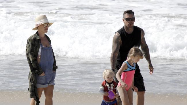 Little Jameson and Willow play in the sand with parents Pink and Carey Hart. Picture: Matrix