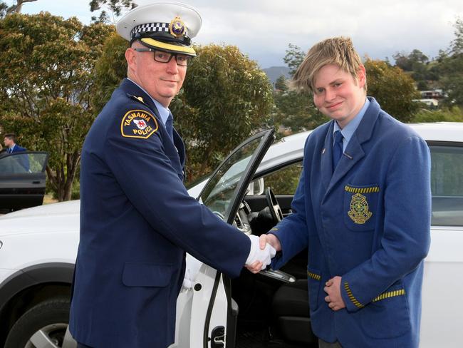 Inspector John Arnold congratulates his son Lewis Arnold.