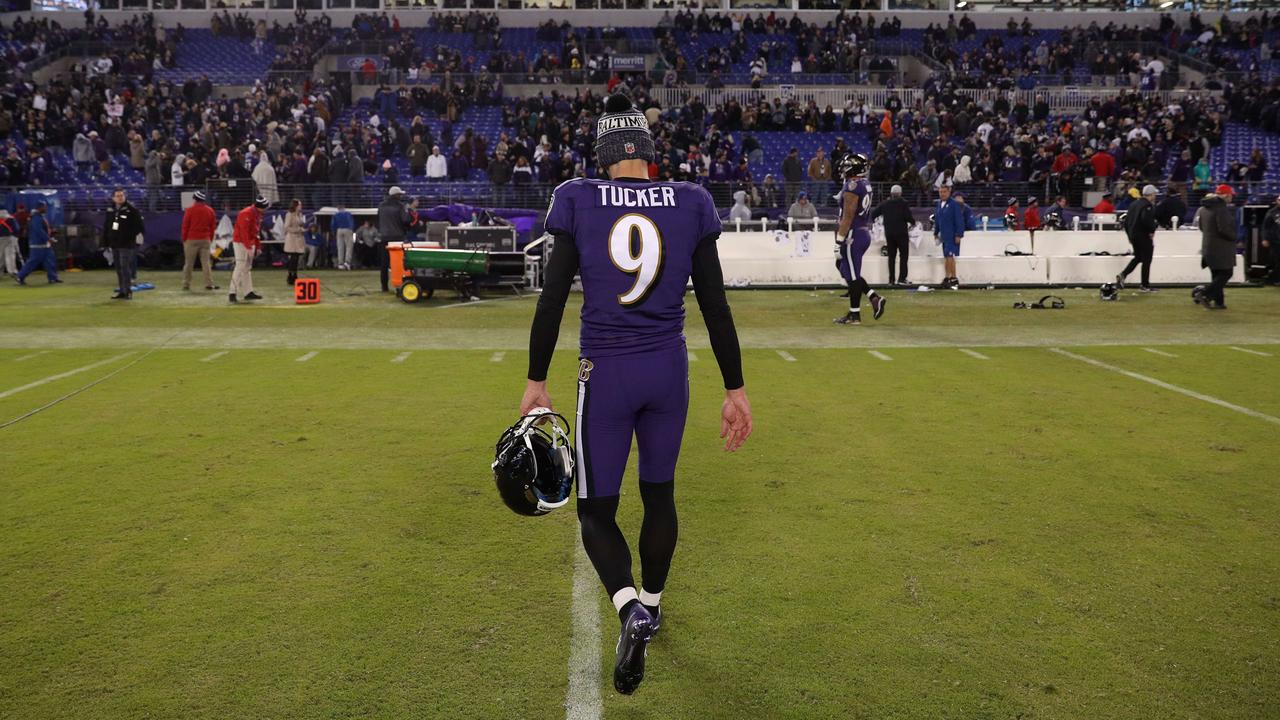 Baltimore kicker Justin Tucker walks off the ground following his missed PAT. Photo: Patrick Smith/Getty Images/AFP