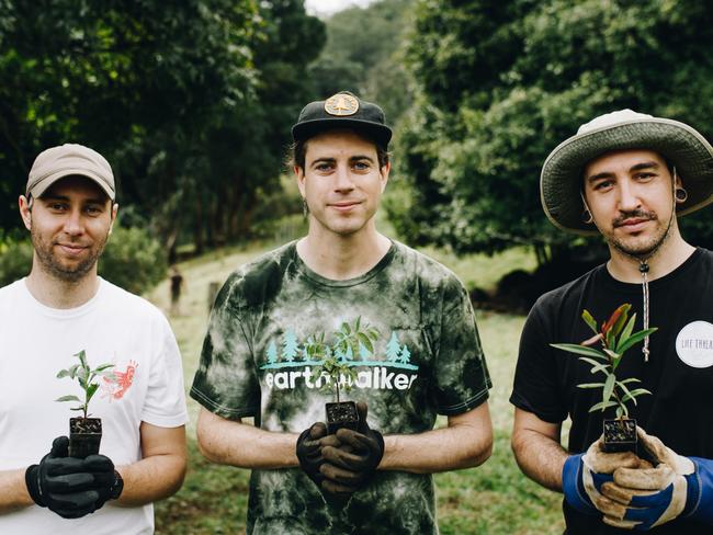 Australian hard rock band In Hearts Wake plant trees to offset carbon emissions of new record. PIcture: Supplied.