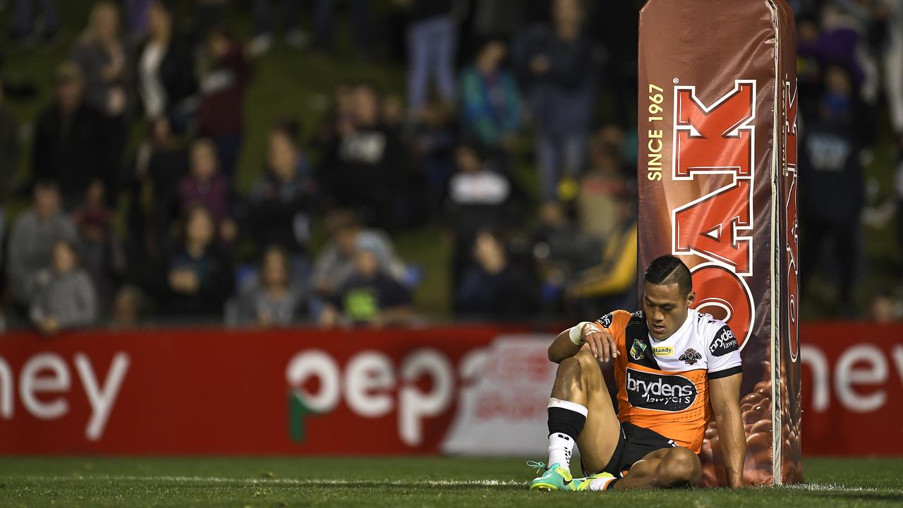 SYDNEY, AUSTRALIA - AUGUST 19: Tim Simona of the Tigers shows his dejection after defeat in the round 24 NRL match between the Penrith Panthers and the Wests Tigers at Pepper Stadium on August 19, 2016 in Sydney, Australia. (Photo by Brett Hemmings/Getty Images)