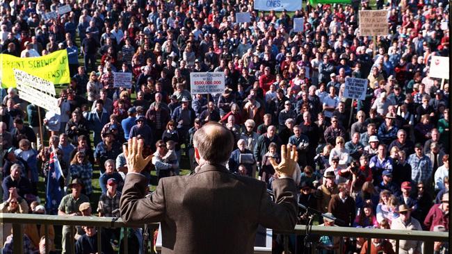 The-then Prime Minister John Howard, wearing what appears to be a bulletproof vest, tries to placate hostile pro-gun rally in regional Victoria in 1996.