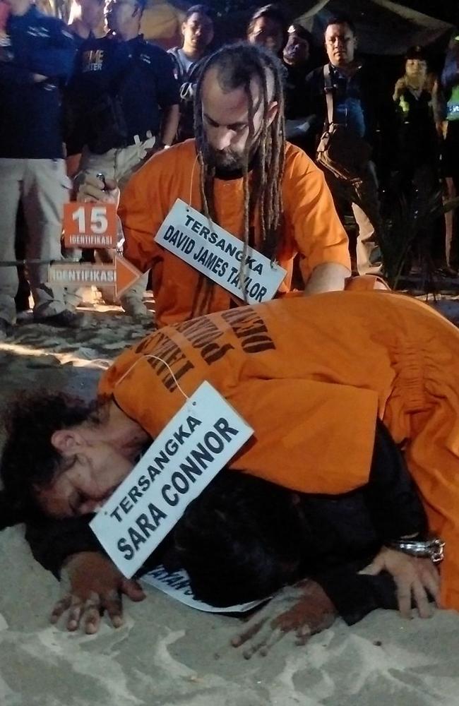 Sara Connor and David Taylor during the reenactment of the encounter on Kuta beach Bali on August 31 Picture: Supplied