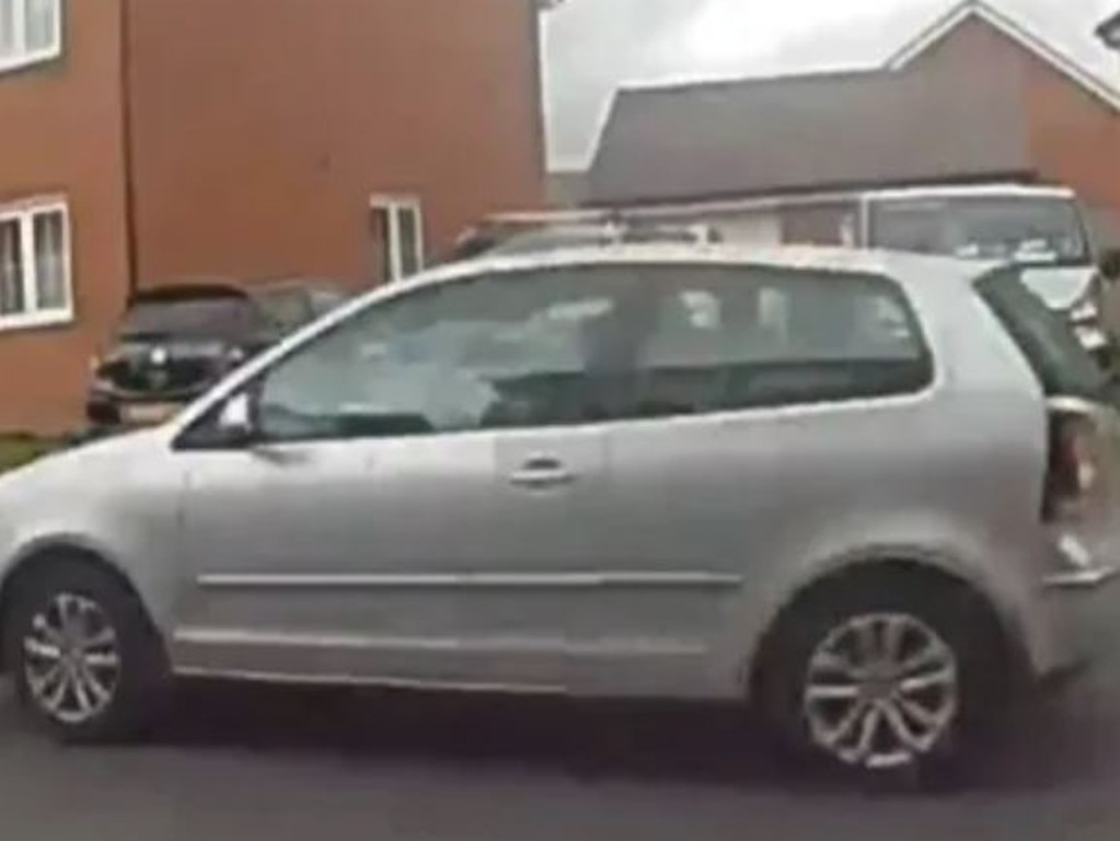 Smith hurries away from the scene in his car. Picture: Supplied/The Sun